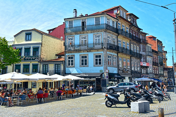The city of Porto.  Outdoor cafes and beautiful restored buildings